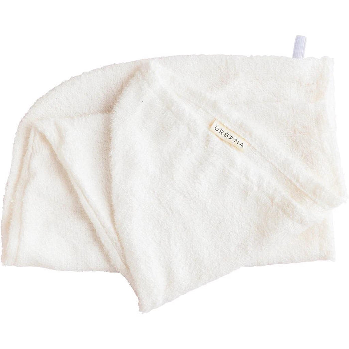 A soft, white BAMBOO HAIR WRAP by EUROPEAN SOAPS, LLC—absorbent and odor-free—features a small label and a hanging loop attached at one corner.