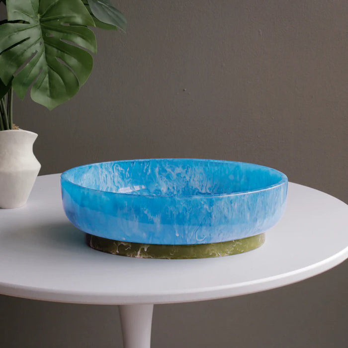 The BEATRIZ BALL RIO Oval Bowl with Base features a glossy, pink marbled finish and a contrasting tan base, displayed against a white background.