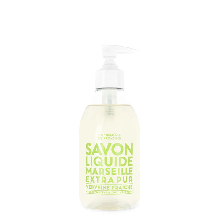 The CIE LUXE BRANDS COMPAGNIE DE PROVENCE Savon Liquide de Marseille Fresh Verbena 10oz is a clear pump bottle of liquid soap with a light green label, scented with fresh verbena and made with nourishing botanical oils.