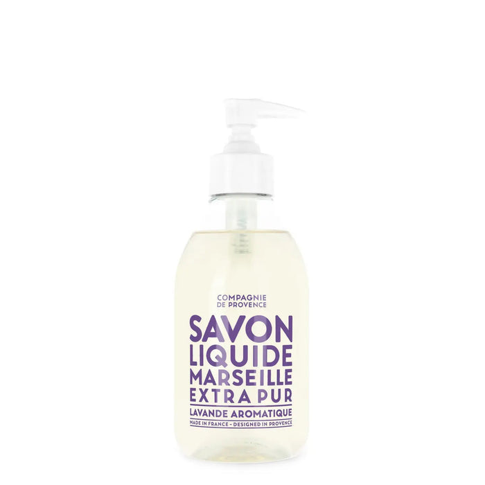 A clear pump bottle of CIE LUXE BRANDS COMPAGNIE DE PROVENCE SAVON LIQUIDE DE MARSEILLE LAVENDER 10OZ with purple text, enriched with botanical oils for a gentle, authentic Marseille soap experience.