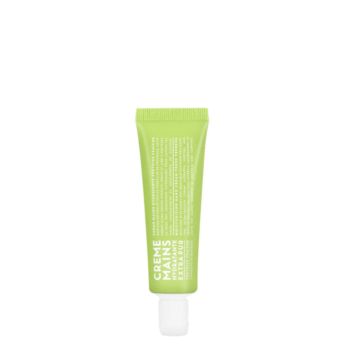 A 1oz green tube of COMPAGNIE DE PROVENCE TRAVEL HAND CREAM FRESH VERBENA by CIE LUXE BRANDS, labeled "Crème Mains Hydratante Extra Pure" in white, with botanical oils, stands upright on a white background.