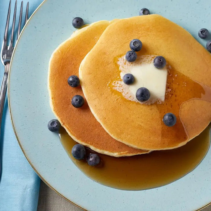 A yellow resealable 907g (32oz) pouch of CUP4CUP Gluten Free Pancake & Waffle Mix features white and blue text, "Gluten Free" label, and is ideal for making pancakes or gluten-free waffles.