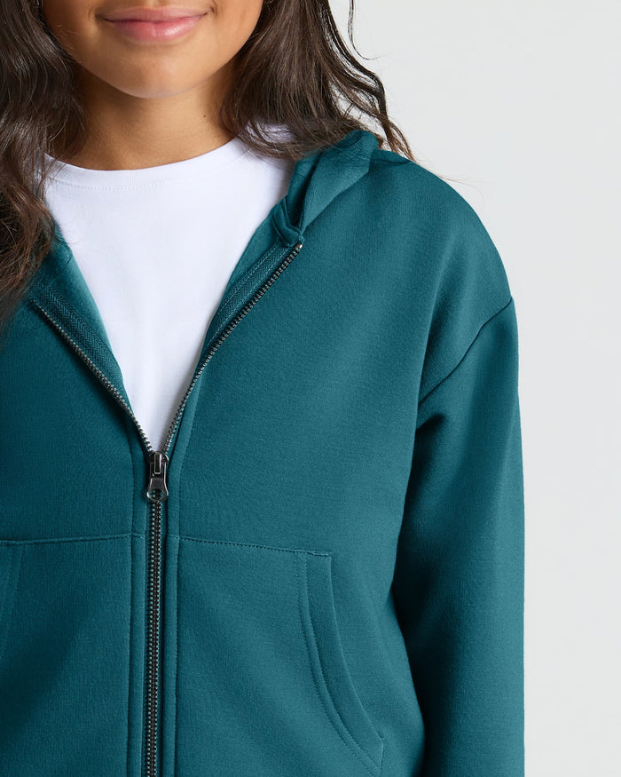 Girl wearing Girls Deep Emerald Cropped Zip Hoodie over white T-shirt.