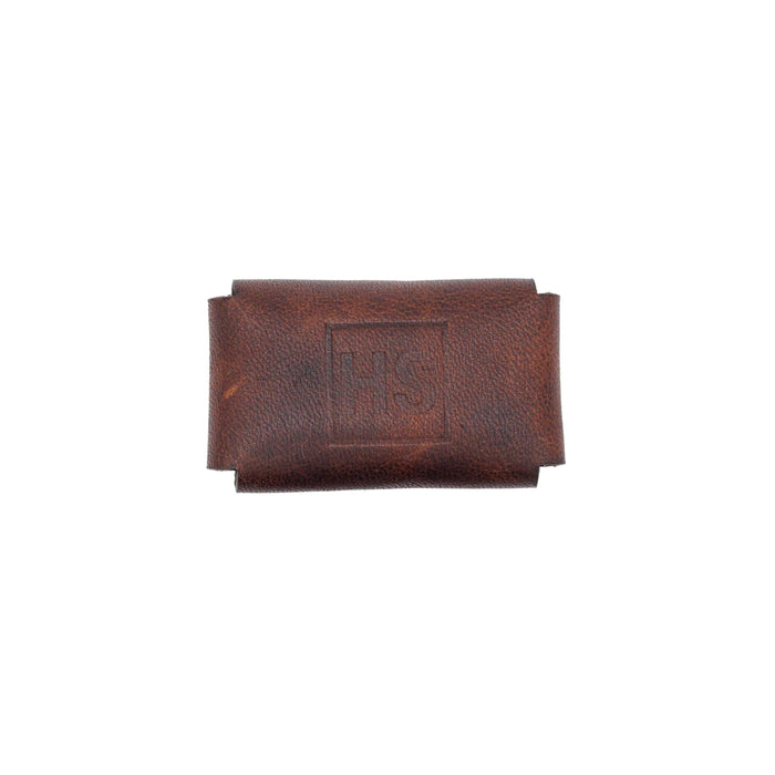 Bottom view of brown leather razor head cover