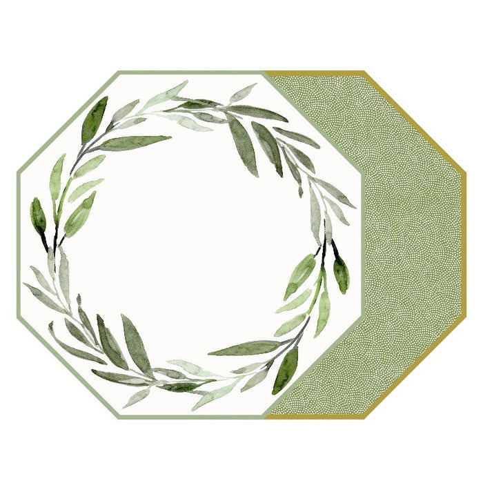 An octagonal HOLLY STUART DESIGNS placemat in Saxon Green features watercolor leaves forming a wreath on white, with a textured green and gold section accenting the right side.