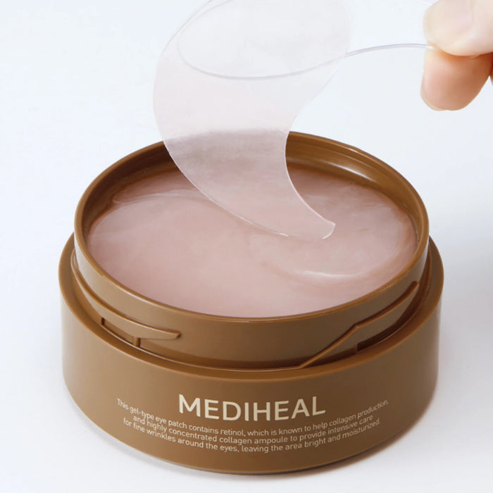 A close-up of two overlapping, translucent glossy MEDIHEAL RETINOL COLLAGEN EYE AMPOULE PATCHES from EXOD INTERNATIONAL, with a pink tint on a white surface. They are smooth and slightly shiny, perfect for anti-aging skincare routines.