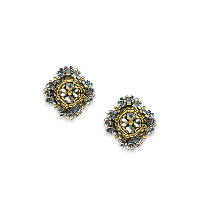 The MIGUEL ASES - PYRITE MIYUKI STUD EARRINGS by MIGUEL ASES, INC. feature square handcrafted studs with gold, silver, and pyrite beads in an intricate geometric pattern on a white background.