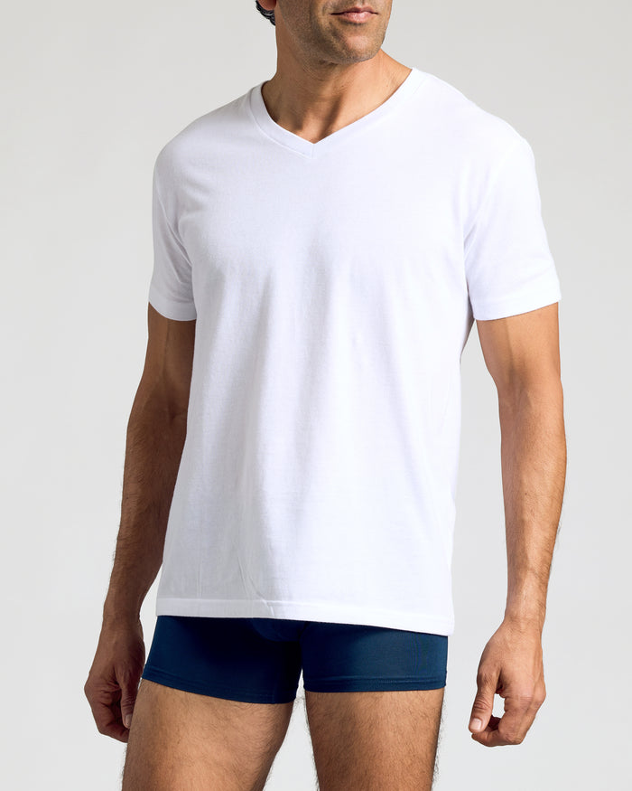 Man wearing Navy Boxer Trunks 3-Pack with white V-neck T-shirt.