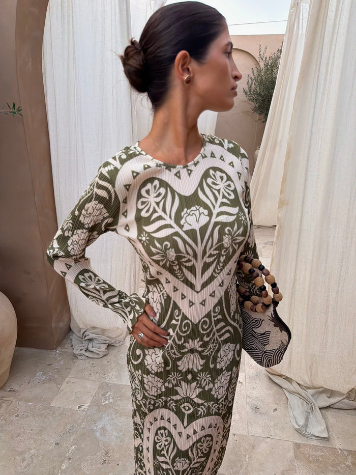 Olive Amara Plisse Gaia Dress featuring a green heart floral print and long sleeves in a textured plisse fabric.