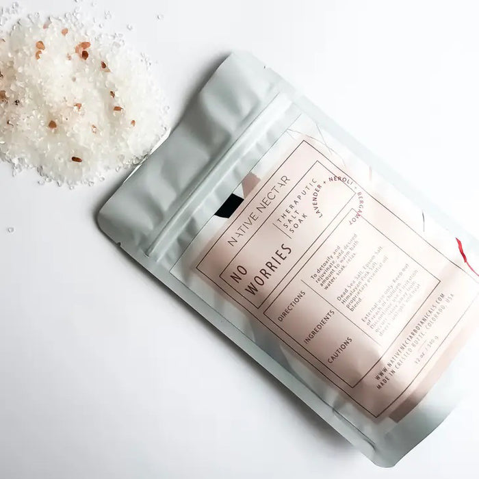 A white resealable pouch labeled "NATIVE NECTAR NO WORRIES SALT SOAK" contains Epsom salt, lavender, rose, and calming essential oils. The packaging includes directions, cautions, and notes it's made in Crested Butte, Colorado, USA.