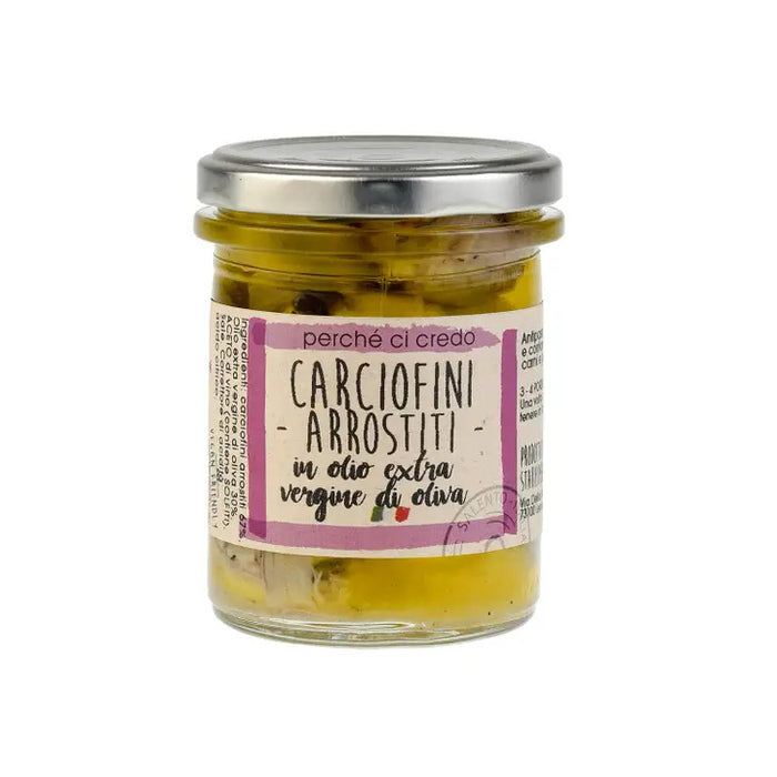 A glass jar of ZIA PIA IMPORTS’ PERCHE CI CREDO - GRILLED ARTICHOKES in extra virgin olive oil, sealed with a metal lid and a pink and white Italian label—ideal for authentic Italian food lovers.