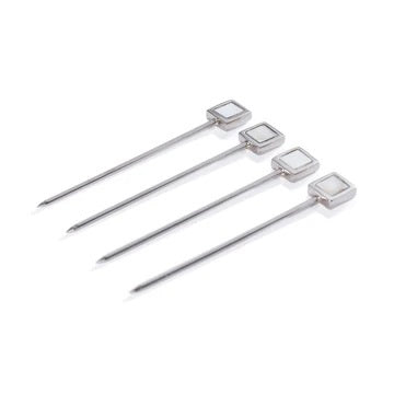 The ZODAX SPIGA Set of 4 Cocktail Picks with Stand features sleek metal picks with square mother of pearl tops in a metallic holder with round base. Ideal for stylish home bars. Set photographed on a plain white background.