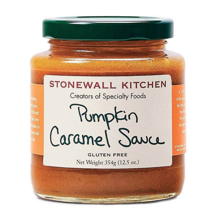 A 354g (12.5 oz) jar of STONEWALL KITCHEN Pumpkin Caramel Sauce, labeled as gluten-free, features a green lid and a label adorned with handwritten-style text spelling out the product's name. This light brown caramel sauce is an ideal fall treat for drizzling over homemade cheesecake.