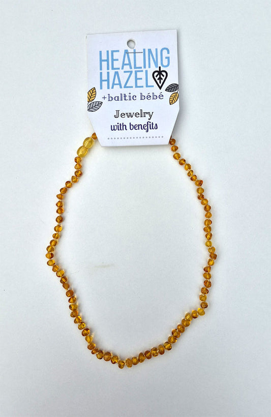 Handmade with 100% certified honey  coloured Baltic amber. Each amber bead is individually knotted into place to secure the beads and for safety in the event of breakage.