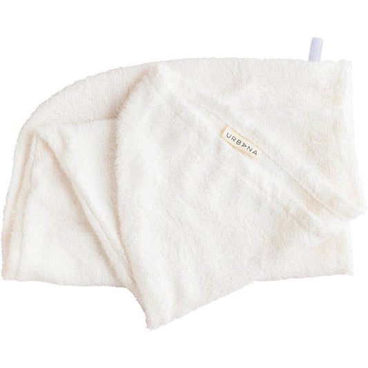 A soft, white BAMBOO HAIR WRAP by EUROPEAN SOAPS, LLC—absorbent and odor-free—features a small label and a hanging loop attached at one corner.