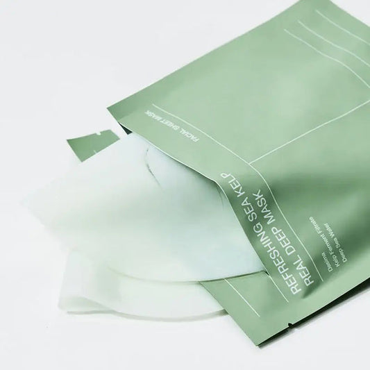 A person applies the BIODANCE - REFRESHING SEA KELP MASK by GLOWISS, partially removing it. Text reads: "3-4 hours. Infused with deep sea water, it absorbs without watery residue on the skin's surface and turns transparent.