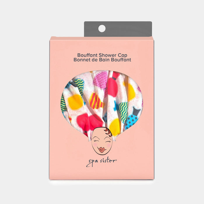 The BATH ACCESSORIES COMPANY BOUFFANT SHOWER CAP - DRESSES is a waterproof cap with a playful multicolored pattern on a light background and an elasticized bottom for a snug fit.