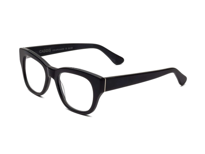CADDIS - MIKLOS READERS by CADDIS, featuring black rectangular bio-based acetate frames with a thick design, displayed at an angle on a white background.
