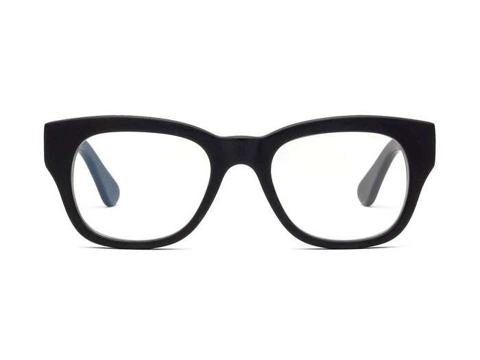 CADDIS - MIKLOS READERS by CADDIS, featuring black rectangular bio-based acetate frames with a thick design, displayed at an angle on a white background.