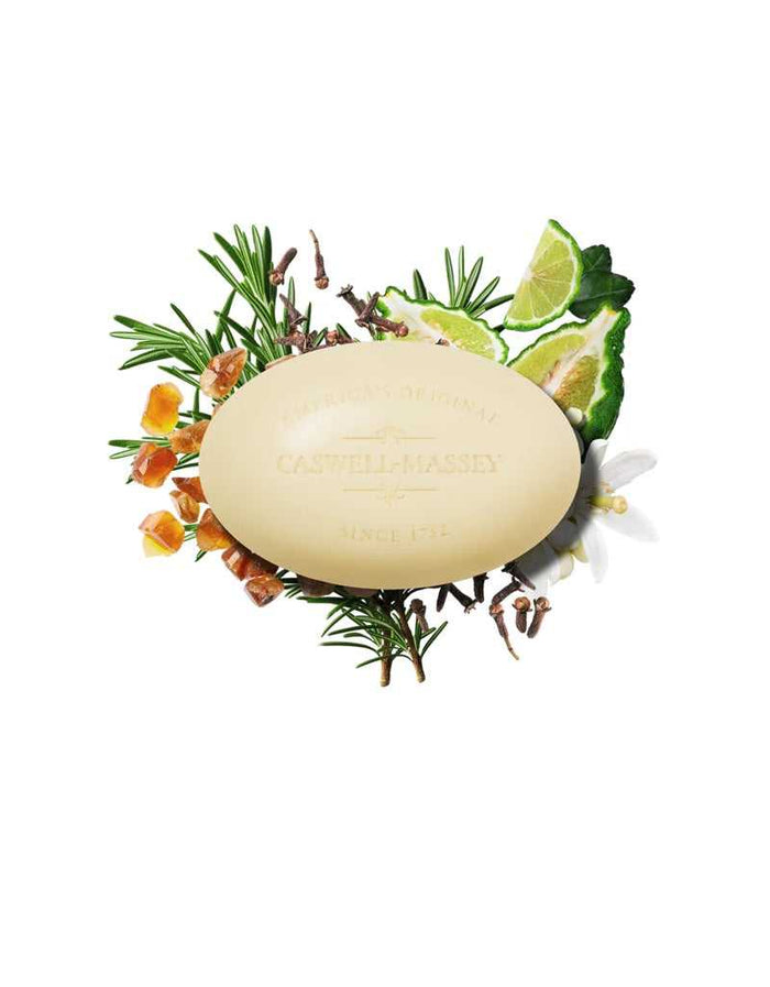 Number Six soap surrounded by citrus, herbs, and botanicals