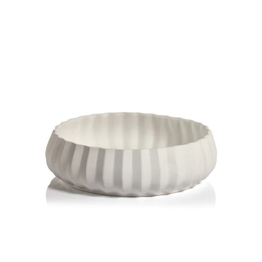 The CATALINA CERAMIC BOWL by ZODAX features a round, shallow white design with a fluted, textured exterior and smooth interior, ideal for display on a 14-inch shelf and shown on a white background.