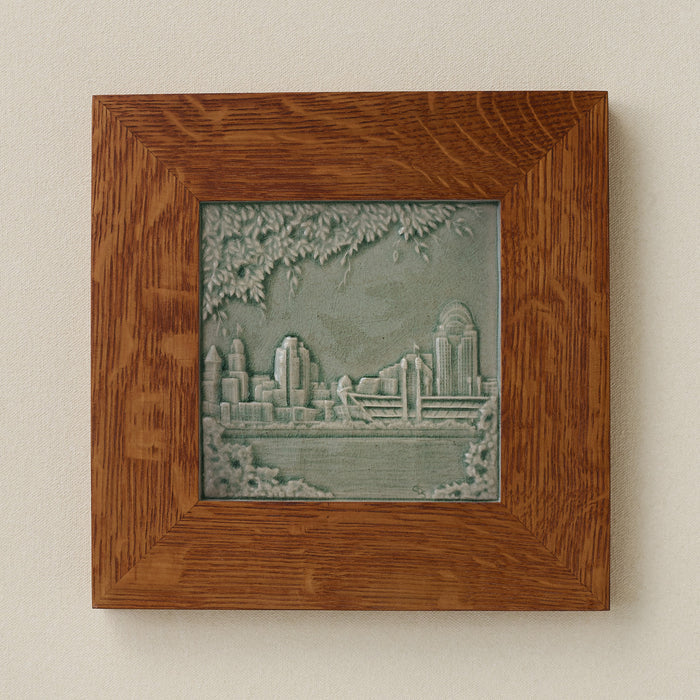 Rookwood Cincinnati Skyline City Scene art tile in a golden oak wood frame