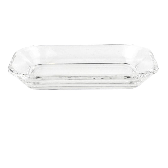 The HOMART CLEAR GLASS SOAP DISH is a rectangular tray with slightly raised sides and rounded corners, elegantly displayed on a white background.