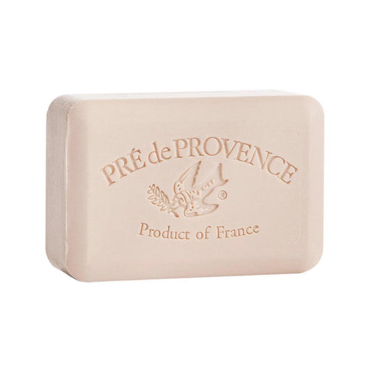 The EUROPEAN SOAPS, LLC COCONUT BAR SOAP 150G is a rectangular beige French soap with “PRÉ de PROVENCE” and “Product of France” engraved, plus a bird holding an olive branch. This shea butter soap provides a gentle, luxurious cleanse.