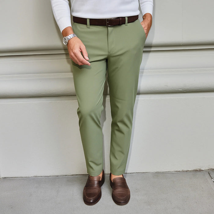 The COLLARS AND CO - Apex Tech Pants in Olive feature a slim fit, button closure, belt loops, and four-way stretch fabric for comfort, shown on a plain white background.