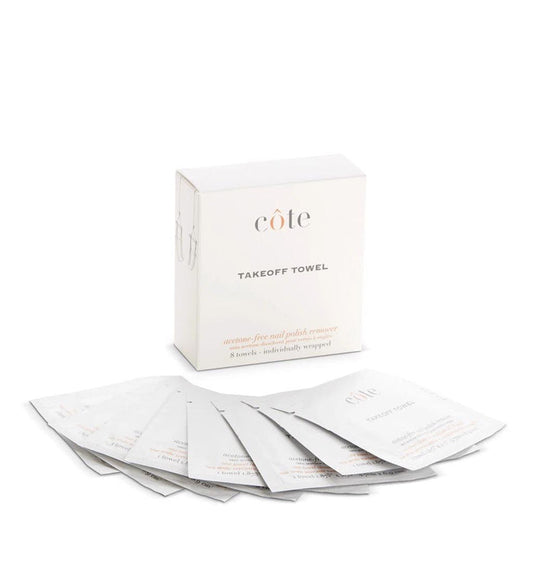 A COTE - TAKE OFF TOWELS - POLISH REMOVER box stands behind eight individually wrapped acetone-free remover towels by COTE, fanned out on a white background.