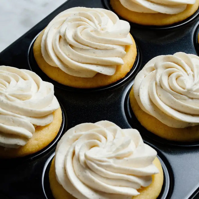 A green and brown package of CUP4CUP GLUTEN FREE YELLOW CAKE MIX by CUP4CUP, labeled "Gluten Free," features an illustration of a yellow layer cake with white frosting and a slice cut out. Perfect for premium baking.