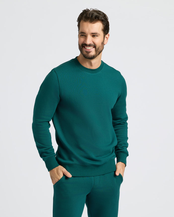 Model wearing Deep Emerald Pullover Fleece Crew & Jogger 2-Pack.