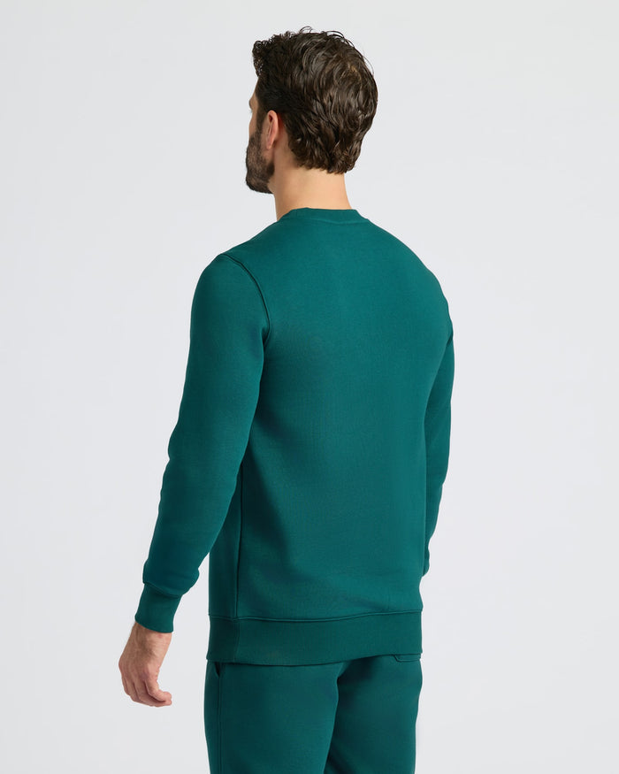 Man wearing Deep Emerald Pullover Fleece Crew & Jogger 2-Pack.