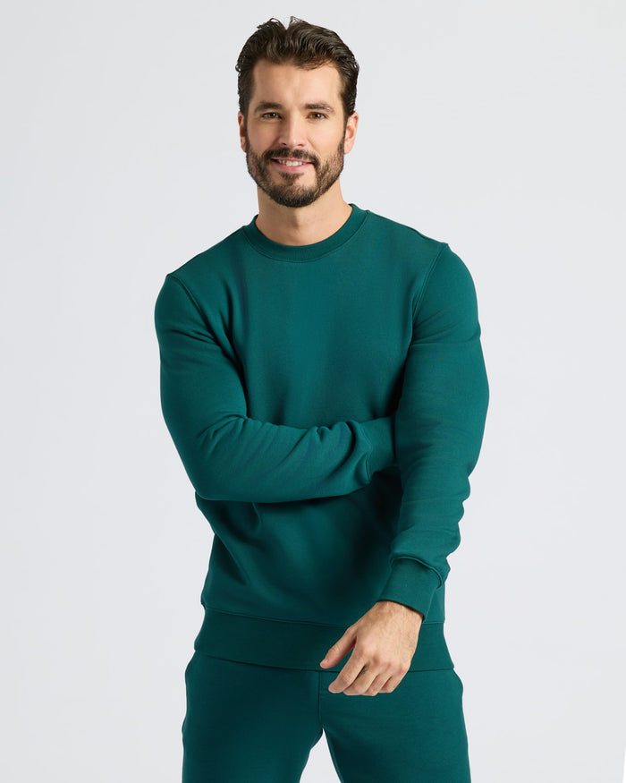 Deep Emerald Fleece French Terry Pullover Crew Neck worn by man smiling.