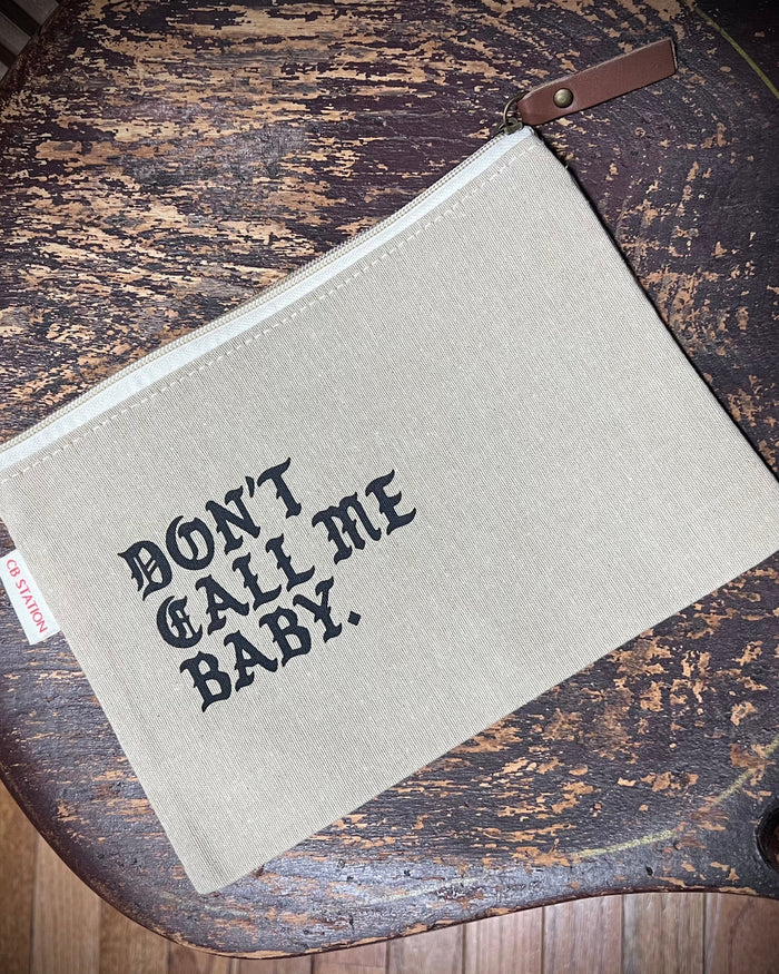 Don't call me baby jute travel pouch with zipper and leather tag - designed printed and sold by Le Monkey House
