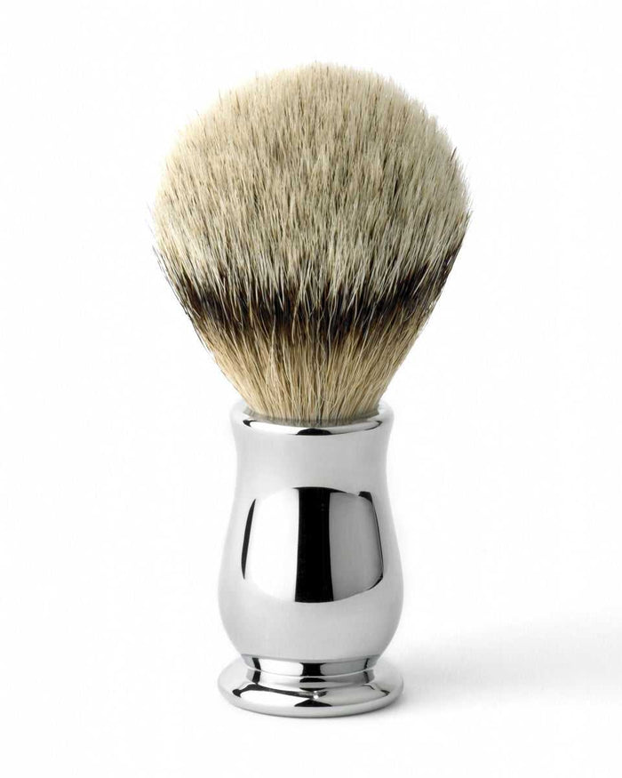 Shaving brush with silver handle and badger bristles for grooming