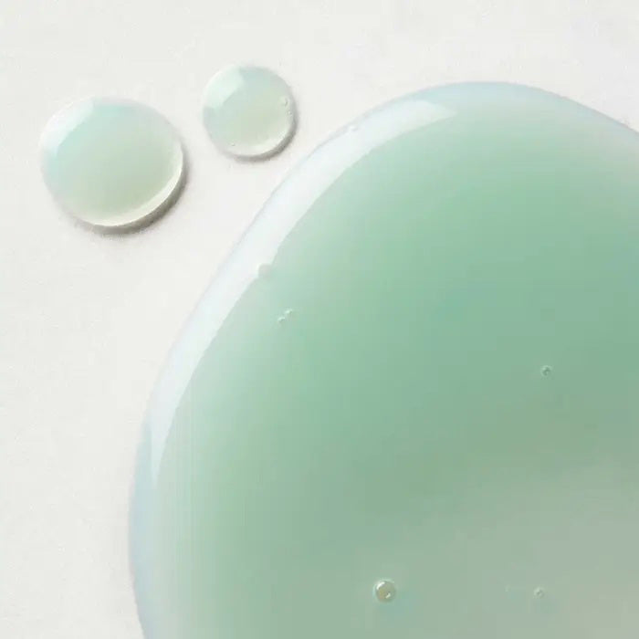 A light teal bottle of ELEMIS - ACHING MUSCLE SUPER SOAK by ELEMIS - STEINER, featuring a silver cap, dark blue text, and a modern design, stands upright on a white background—perfect for post-workout muscle recovery.