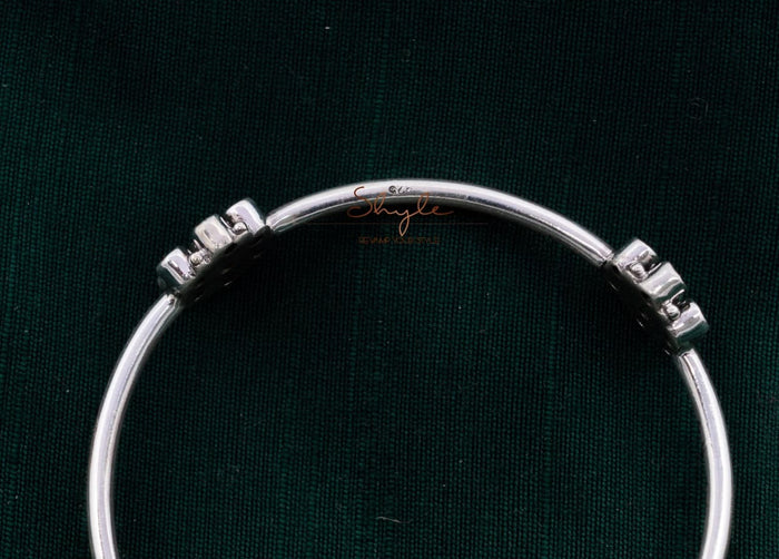 Close-up of 925 hallmark stamp on silver jadau flower bangle