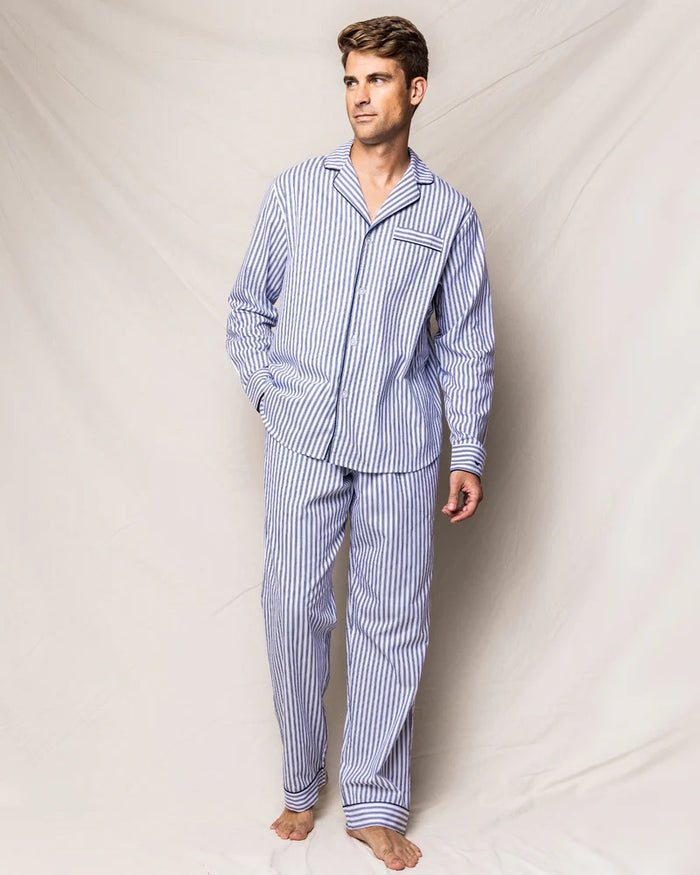 The folded FEARRINGTON LIFESTYLE COLLECTION - MENS TWILL NAVY FRENCH TICKING PAJAMAS by PETITE PLUME features luxury cotton sleepwear in white with navy stripes, a chest pocket with embroidered sheep, and a “Petite Plume” tag on the collar.