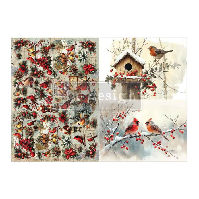A collage-style Christmas bird design sheet featuring multiple illustrations: red birds, a snow-covered birdhouse with berries, pinecones, ornaments, and a winter tree background. A faint 'Design' watermark is visible across the center.