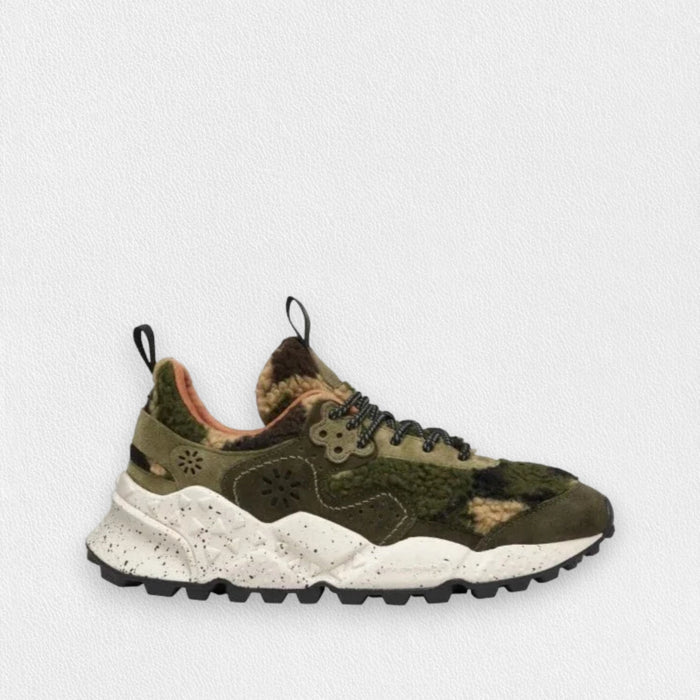 The FLOWER MOUNTAIN - KOKETSU SNEAKER by FLOWER MOUNTAIN/FALC USA features a chunky white speckled sole, olive and tan camo teddy-effect upper, black laces and pull tabs, plus an anatomical cork insole, shown on a plain light background.