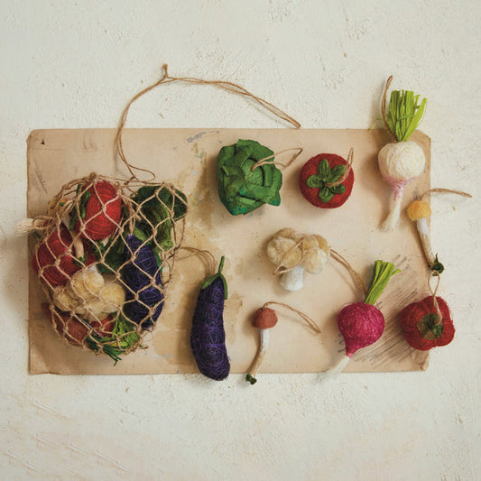 The CREATIVE COOP FOAM VEGETABLE ORNAMENTS SET OF 13 offers colorful faux veggies, ideal for vibrant decor or playful displays.