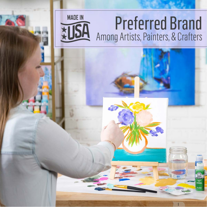 Person painting a floral scene on an easel with a 'Made in USA' brand banner above.
