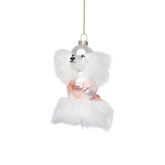The ZODAX GLASS STANDARD POODLE ORNAMENT features a white poodle with fluffy fur and a pink outfit, hanging from a gold string. Sized 3" x 2" x 4.5", it fits perfectly in a small box—ideal for festive decor or gifting.