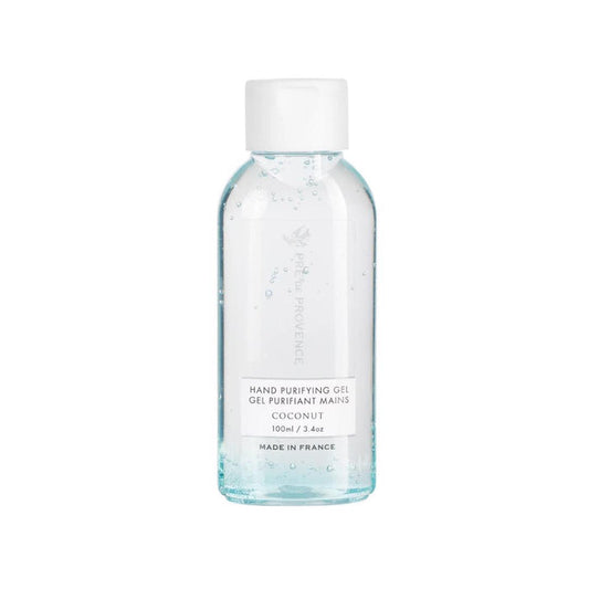 A clear plastic bottle with a white cap contains transparent HAND PURIFYING GEL - COCONUT by EUROPEAN SOAPS, LLC, labeled "70% alcohol, 100ml / 3.4oz, Made in France.