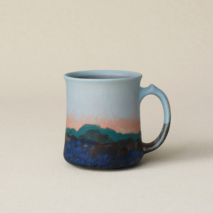 Hand-thrown ceramic mug by Rookwood Pottery