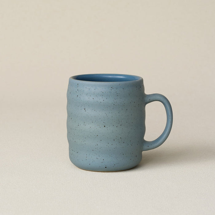 Hand-thrown ceramic mug by Rookwood Pottery