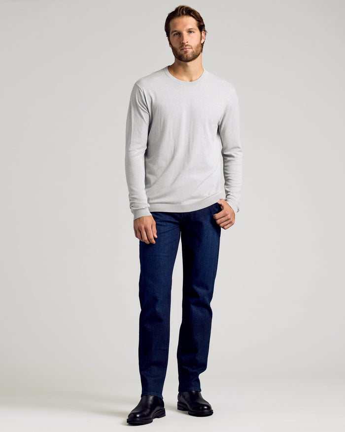 Man wearing Dressy Crew Neck Sweater 3-Pack, jeans, and boots.
