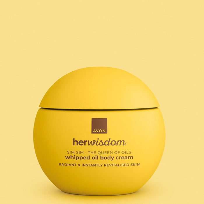 A round yellow jar of Avon Her Wisdom Sim Sim whipped oil body cream, set against a matching pale yellow background.