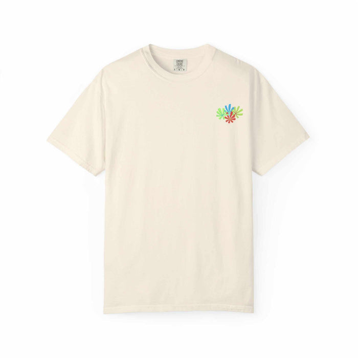 Island Tropical T-shirt in cream color with small colorful floral design on chest.
